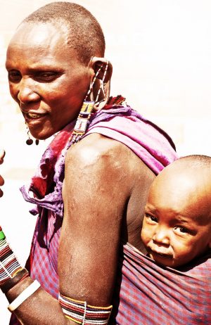 AFRICA, KENYA, AMBOSELI,NOVEMBER 5: Amboseli tribe woman with her small baby,portrait of an African family,review of daily life of local people, Amboseli 2008